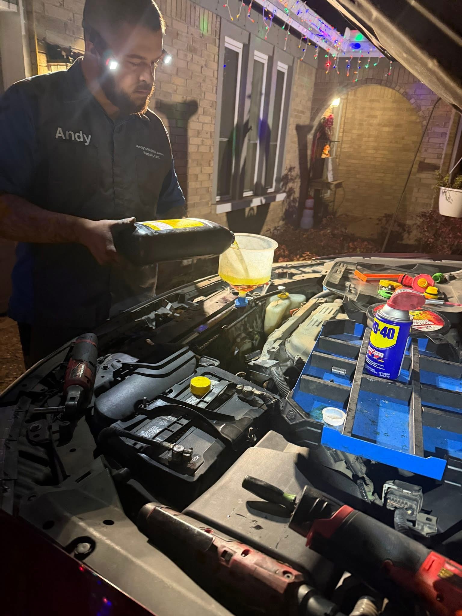 Andy repairing a customer's vehicle